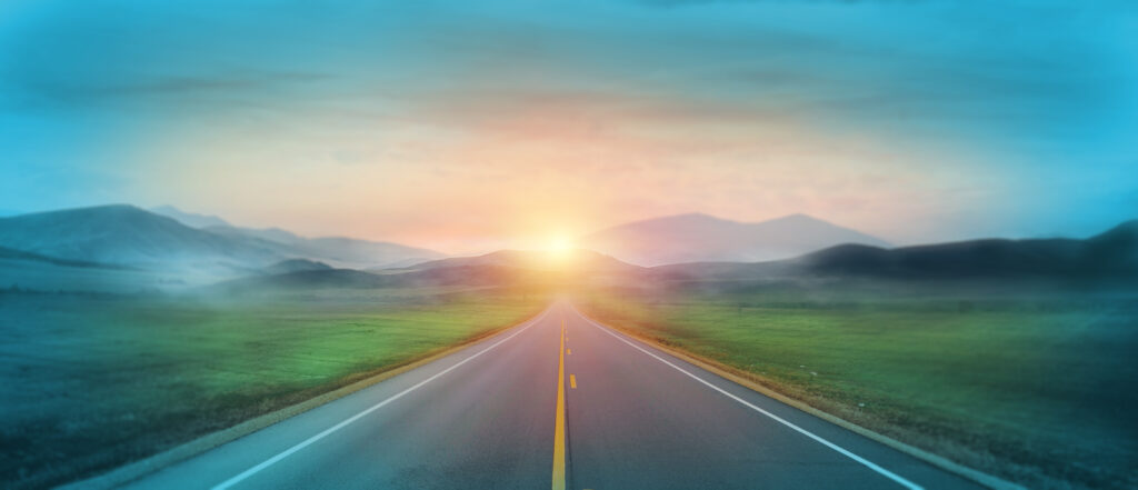 Mountain road. Landscape with green field, sunny sky